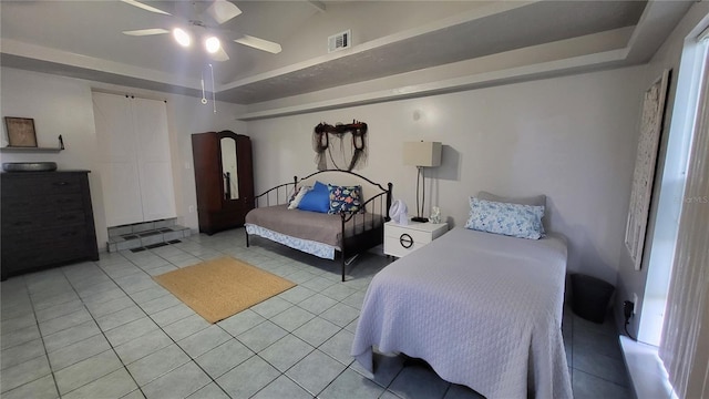 tiled bedroom with ceiling fan