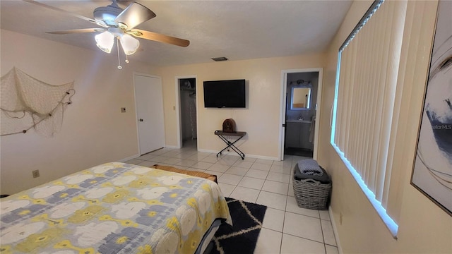 tiled bedroom with ceiling fan