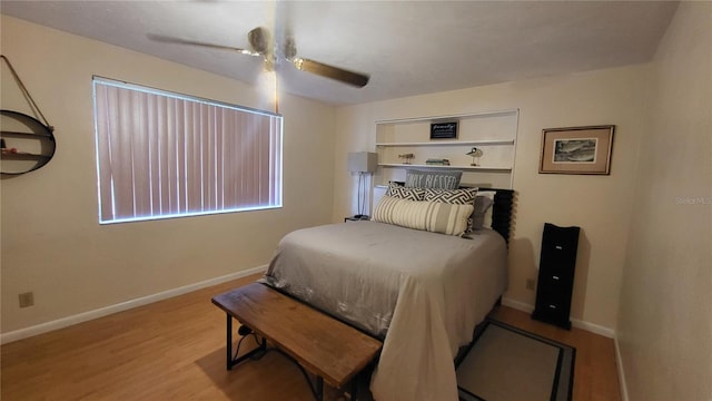 bedroom with ceiling fan and light wood-type flooring