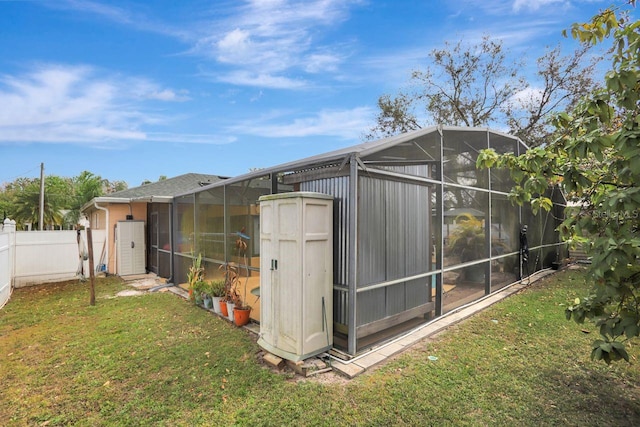 view of outbuilding with fence