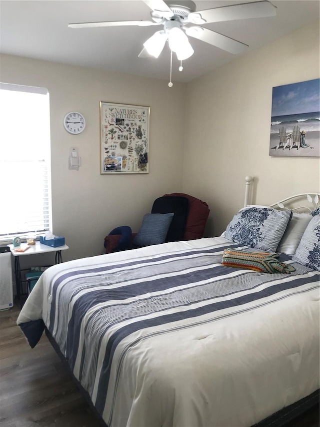 bedroom featuring dark wood-type flooring and ceiling fan