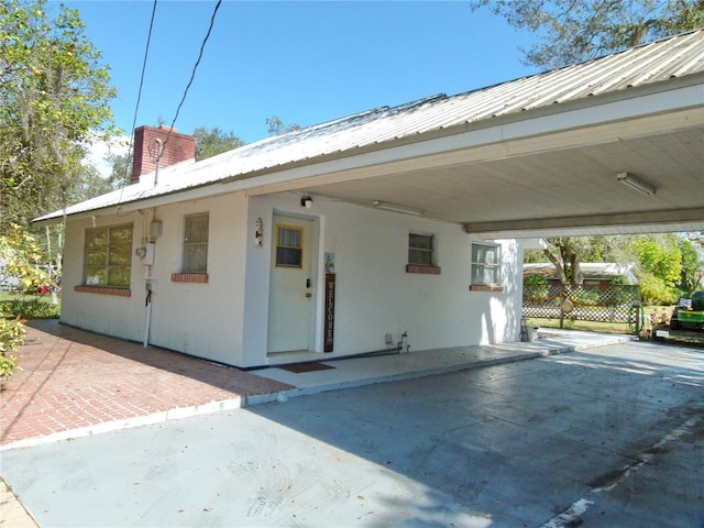 view of front of home featuring a carport