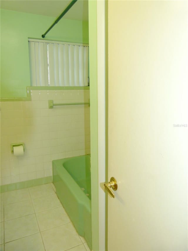 bathroom featuring tile walls and tile patterned floors