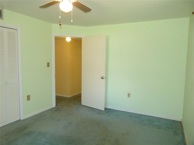 unfurnished bedroom featuring ceiling fan, a closet, and light carpet