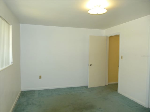 unfurnished room with carpet