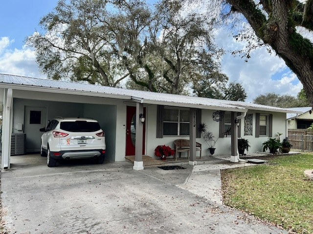 ranch-style house with a carport