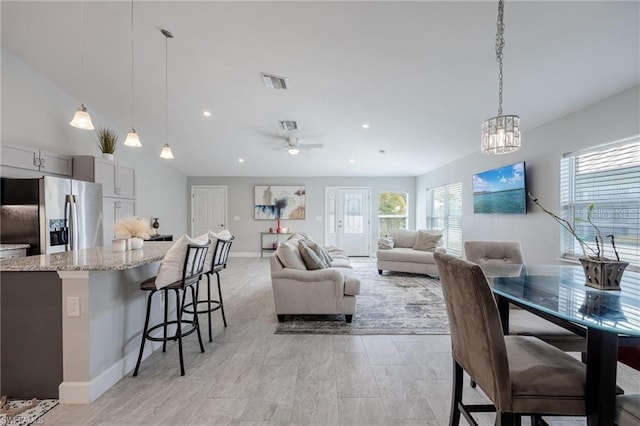 interior space with ceiling fan, visible vents, baseboards, and recessed lighting