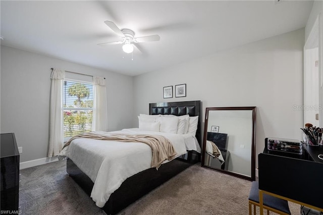 carpeted bedroom featuring a ceiling fan and baseboards