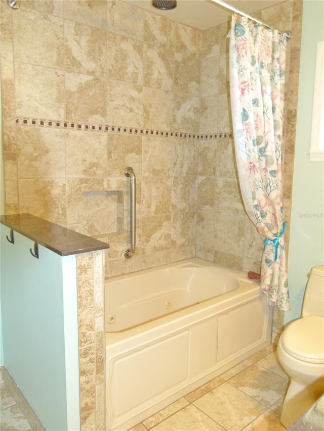 full bathroom featuring toilet, shower / bath combo with shower curtain, and tile patterned floors