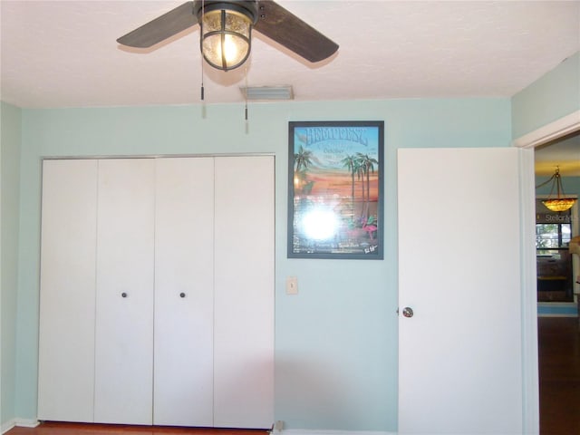 unfurnished bedroom featuring a closet, visible vents, and a ceiling fan