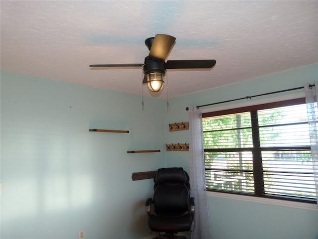 office area featuring a textured ceiling and ceiling fan