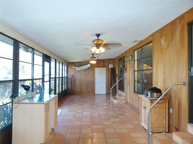 sunroom / solarium with ceiling fan