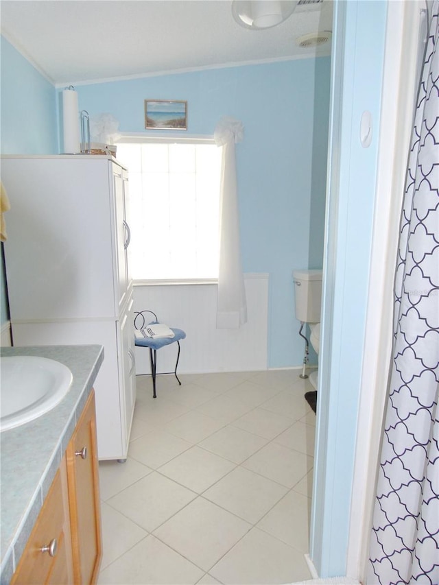 bathroom featuring ornamental molding, tile patterned floors, vanity, and curtained shower