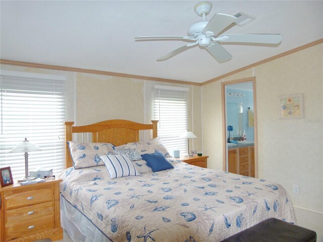 bedroom with visible vents, lofted ceiling, ensuite bath, ceiling fan, and ornamental molding