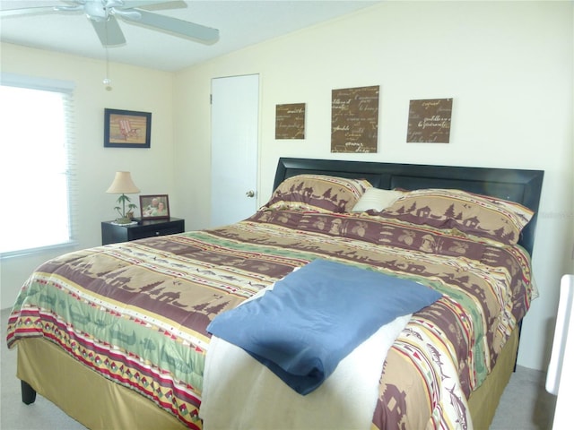 bedroom with ceiling fan and vaulted ceiling