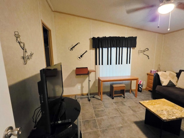 1601 US Highway 441 SE Unit 24, Okeechobee, FL 34974 - living area with crown molding, ceiling fan, tile patterned floors, and lofted ceiling