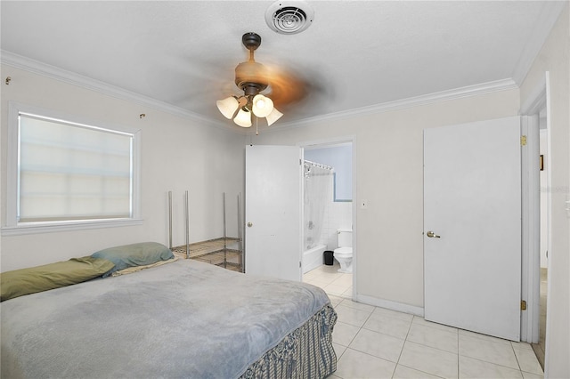 bedroom with visible vents, ornamental molding, connected bathroom, light tile patterned flooring, and ceiling fan