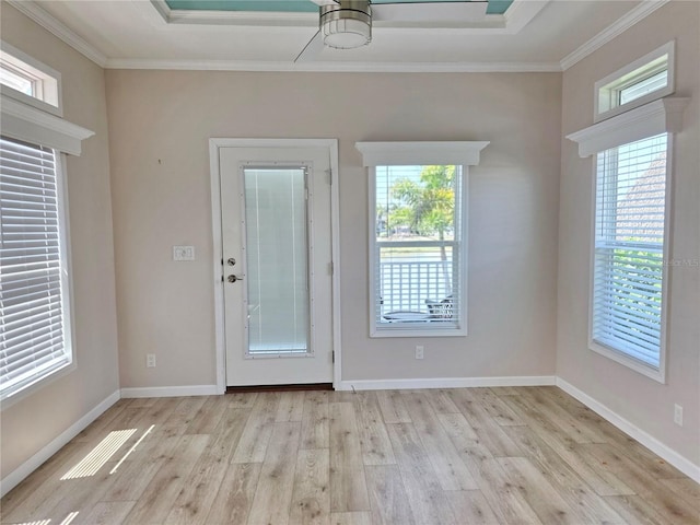 649 SW 34th Cv Unit 392, Okeechobee, FL 34974 - foyer with wood finished floors, ornamental molding, healthy amount of natural light, and a ceiling fan