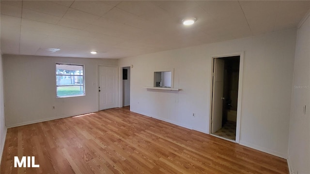 3007 SE 34th Ct, Okeechobee, FL 34974 - spare room with light wood-style flooring and baseboards