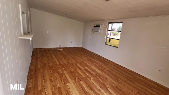 3007 SE 34th Ct, Okeechobee, FL 34974 - empty room with a wall mounted air conditioner and wood finished floors