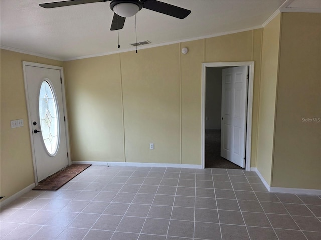7895 NW 84th Ct, Okeechobee, FL 34972 - foyer entrance featuring visible vents, a ceiling fan, crown molding, and tile patterned flooring