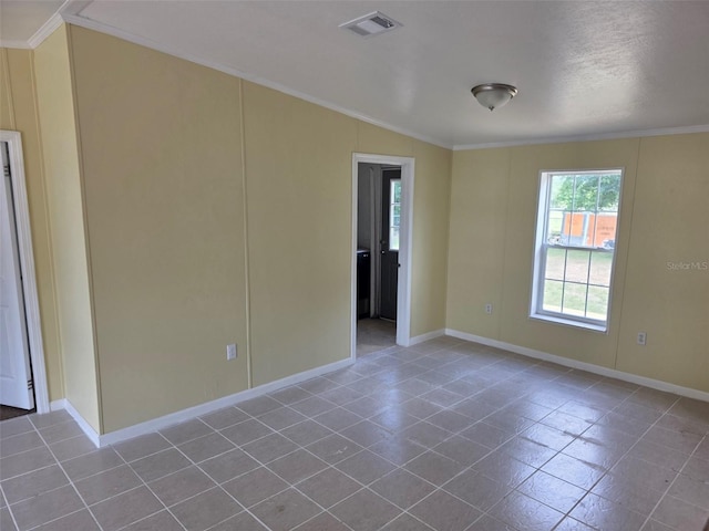 7895 NW 84th Ct, Okeechobee, FL 34972 - spare room featuring visible vents, baseboards, crown molding, and tile patterned flooring