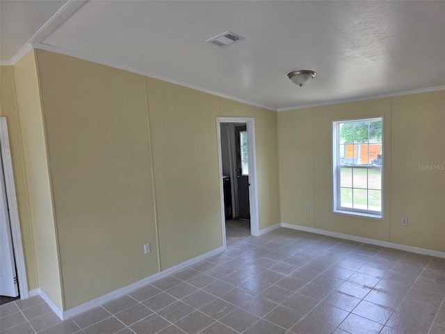 7895 NW 84th Ct, Okeechobee, FL 34972 - tiled spare room featuring visible vents, baseboards, and crown molding