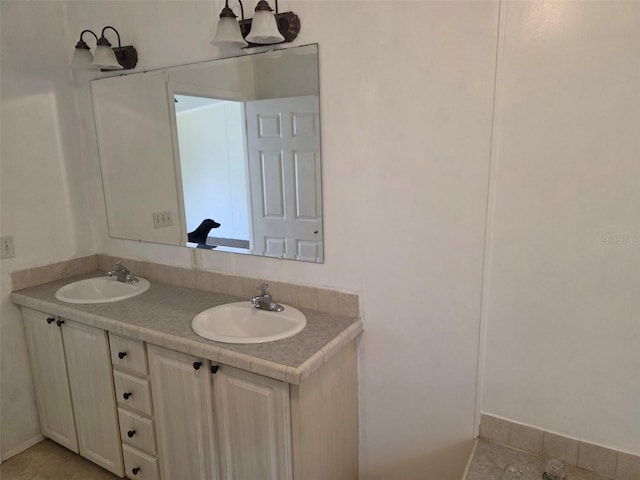 7895 NW 84th Ct, Okeechobee, FL 34972 - full bathroom with a sink, tile patterned flooring, and double vanity