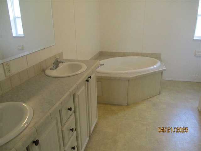 7895 NW 84th Ct, Okeechobee, FL 34972 - full bathroom with a sink, double vanity, and a bath