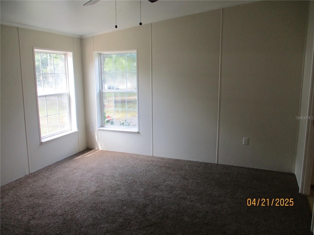 7895 NW 84th Ct, Okeechobee, FL 34972 - unfurnished room featuring carpet floors and a ceiling fan