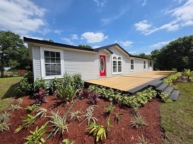 7895 NW 84th Ct, Okeechobee, FL 34972 - rear view of house featuring a wooden deck