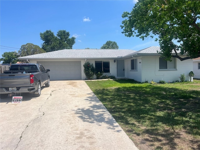 single story home with a garage, a front yard, driveway, and roof with shingles