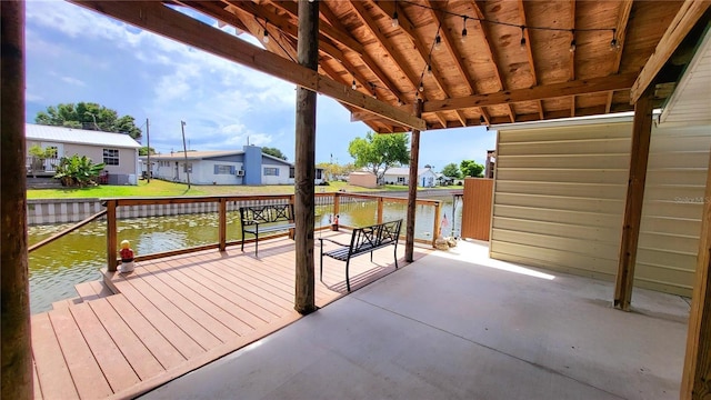 1066 5th St, Okeechobee, FL 34974 - wooden deck featuring a water view and a residential view