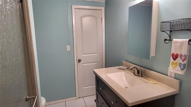 1066 5th St, Okeechobee, FL 34974 - bathroom featuring vanity, toilet, and tile patterned flooring