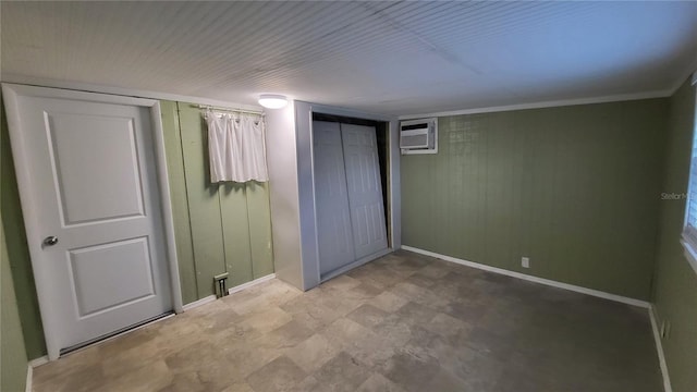 1066 5th St, Okeechobee, FL 34974 - unfurnished bedroom with baseboards and a wall mounted air conditioner