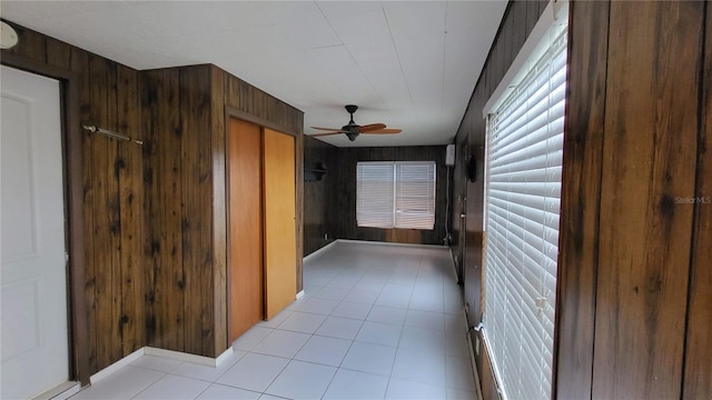1066 5th St, Okeechobee, FL 34974 - corridor featuring wooden walls and light tile patterned floors