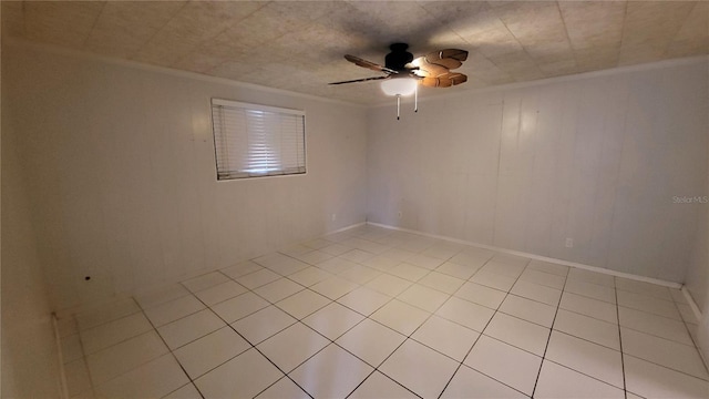 1066 5th St, Okeechobee, FL 34974 - spare room with a ceiling fan, ornamental molding, and light tile patterned floors