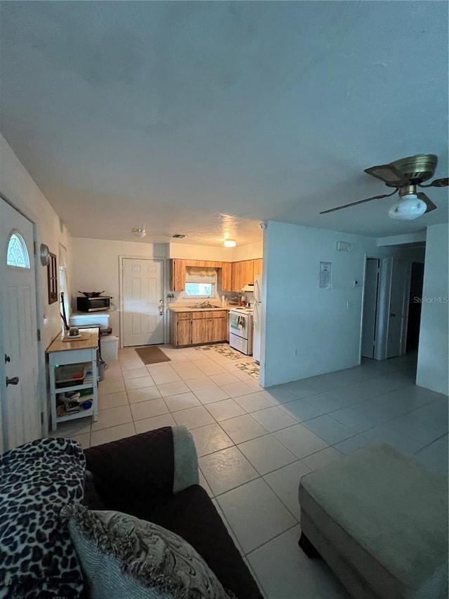 508 NW 17th St, Okeechobee, FL 34972 - living area with light tile patterned floors and a ceiling fan