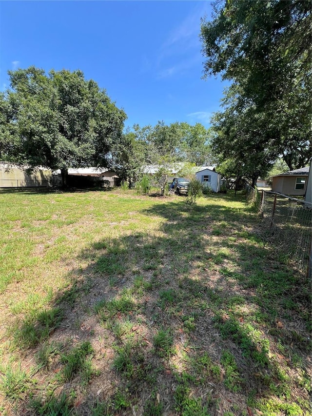 508 NW 17th St, Okeechobee, FL 34972 - view of yard featuring a shed and an outdoor structure