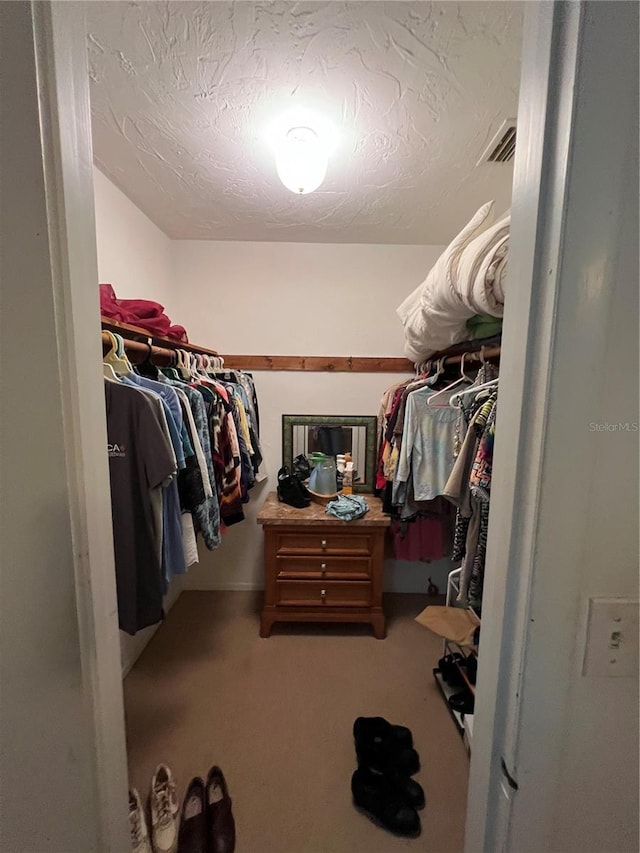 508 NW 17th St, Okeechobee, FL 34972 - walk in closet featuring carpet