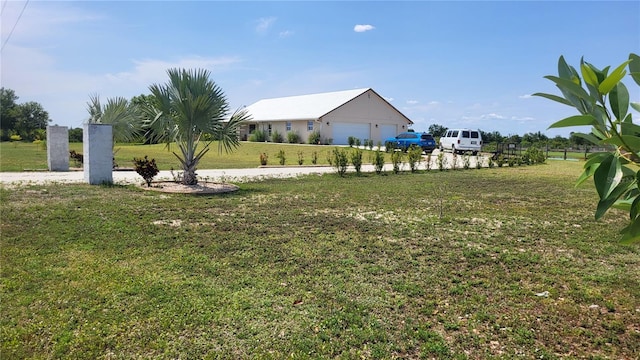 16159 NW 258th St, Okeechobee, FL 34972 - view of yard featuring a garage