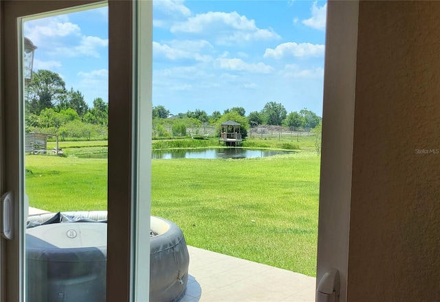 16159 NW 258th St, Okeechobee, FL 34972 - doorway to outside featuring a water view and a textured wall