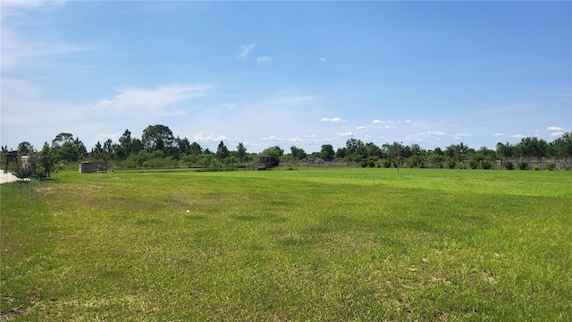 16159 NW 258th St, Okeechobee, FL 34972 - view of green lawn with a view of rural / pastoral area