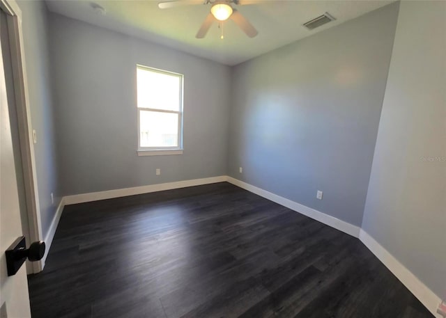 4486 SW Cacao St, Port St Lucie, FL 34953 - empty room featuring dark wood finished floors, a ceiling fan, and baseboards