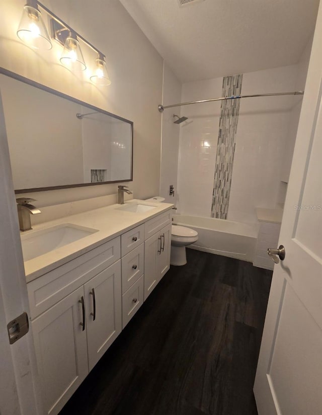 4486 SW Cacao St, Port St Lucie, FL 34953 - bathroom featuring double vanity, wood finished floors, bathtub / shower combination, and toilet