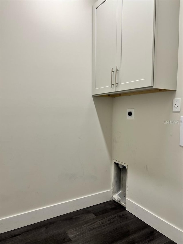 4486 SW Cacao St, Port St Lucie, FL 34953 - laundry room with hookup for an electric dryer, cabinet space, dark wood-type flooring, and baseboards