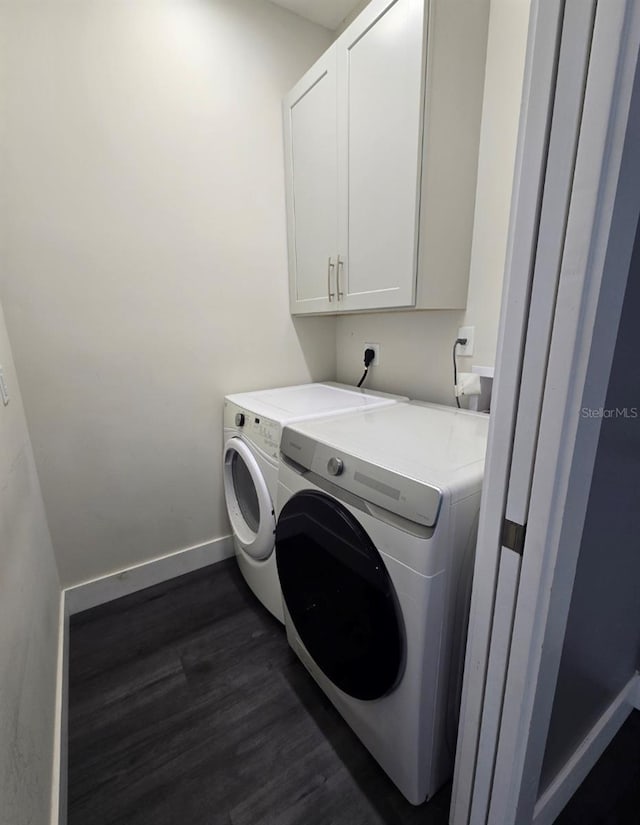4486 SW Cacao St, Port St Lucie, FL 34953 - clothes washing area with cabinet space, dark wood-style flooring, independent washer and dryer, and baseboards