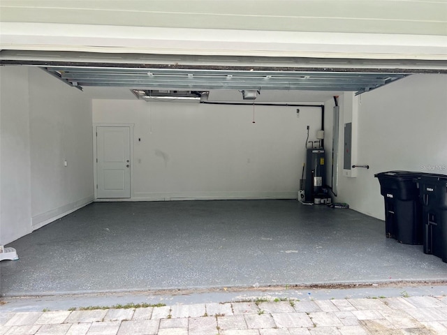 4486 SW Cacao St, Port St Lucie, FL 34953 - garage featuring water heater, electric panel, and a garage door opener