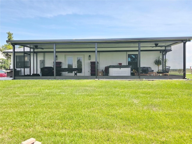 7935 NW 90th Ct, Okeechobee, FL 34972 - rear view of house with a sunroom and a yard