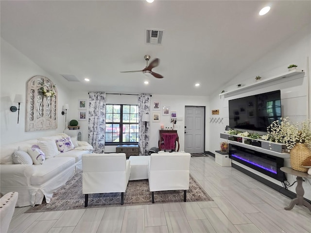7935 NW 90th Ct, Okeechobee, FL 34972 - living room featuring a ceiling fan, recessed lighting, and vaulted ceiling